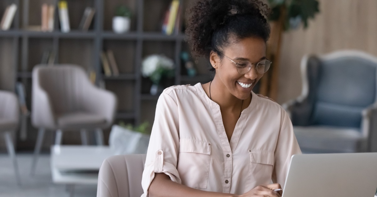 african american woman reviewing budget online
