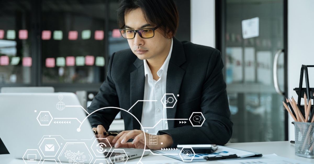 focused businessman using laptop at work
