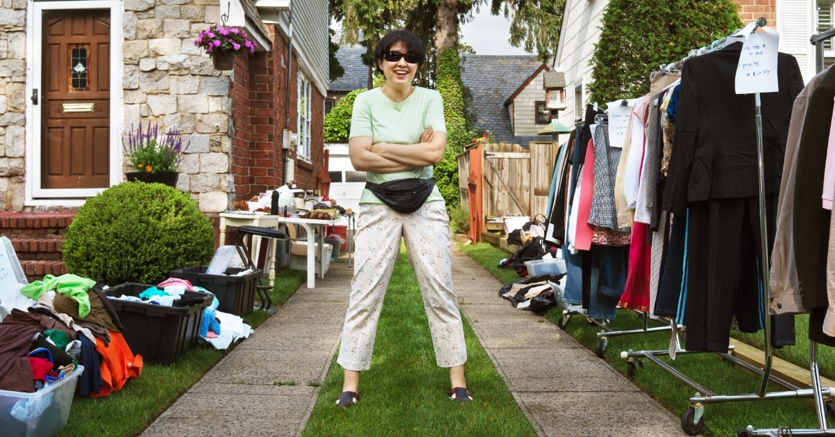 woman welcoming clients to yard sale