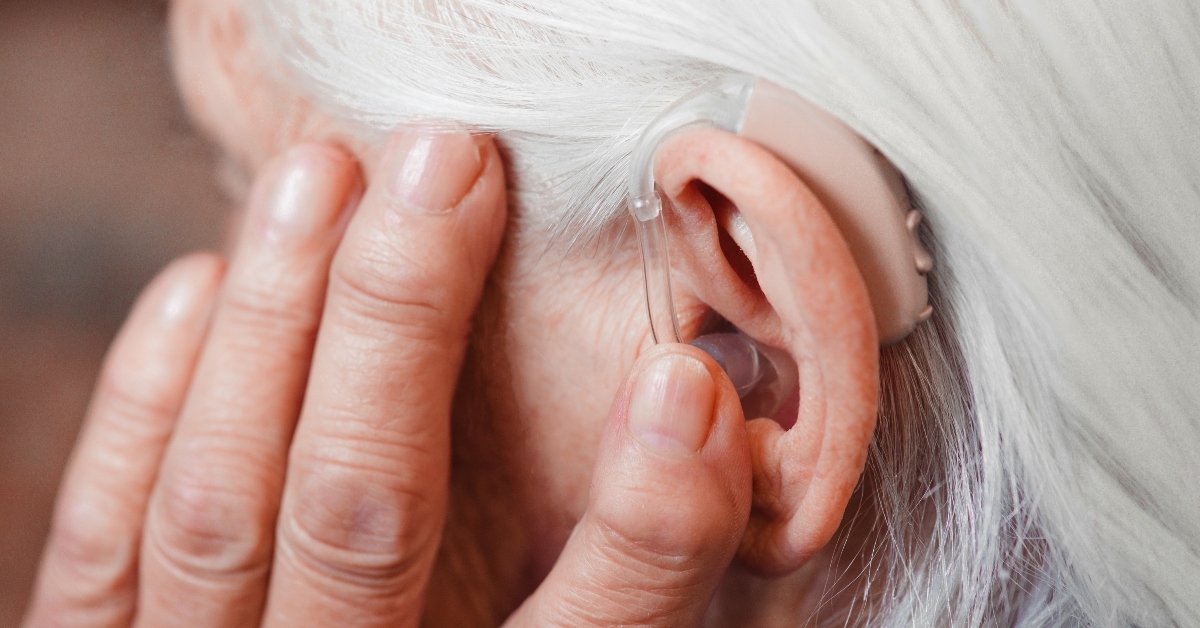 Senior woman with hearing aid