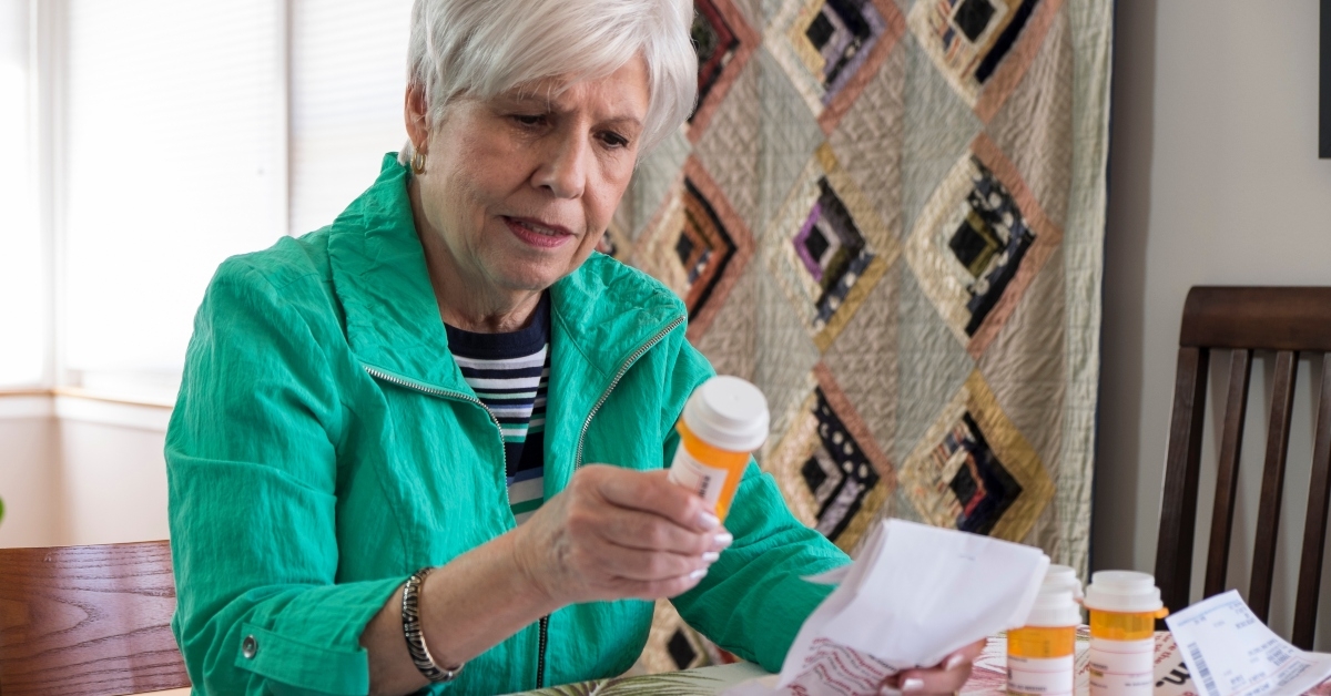 woman looking over medical bills