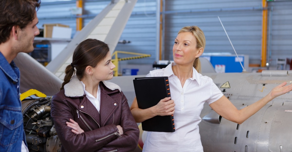 woman showing vehicles to young internees