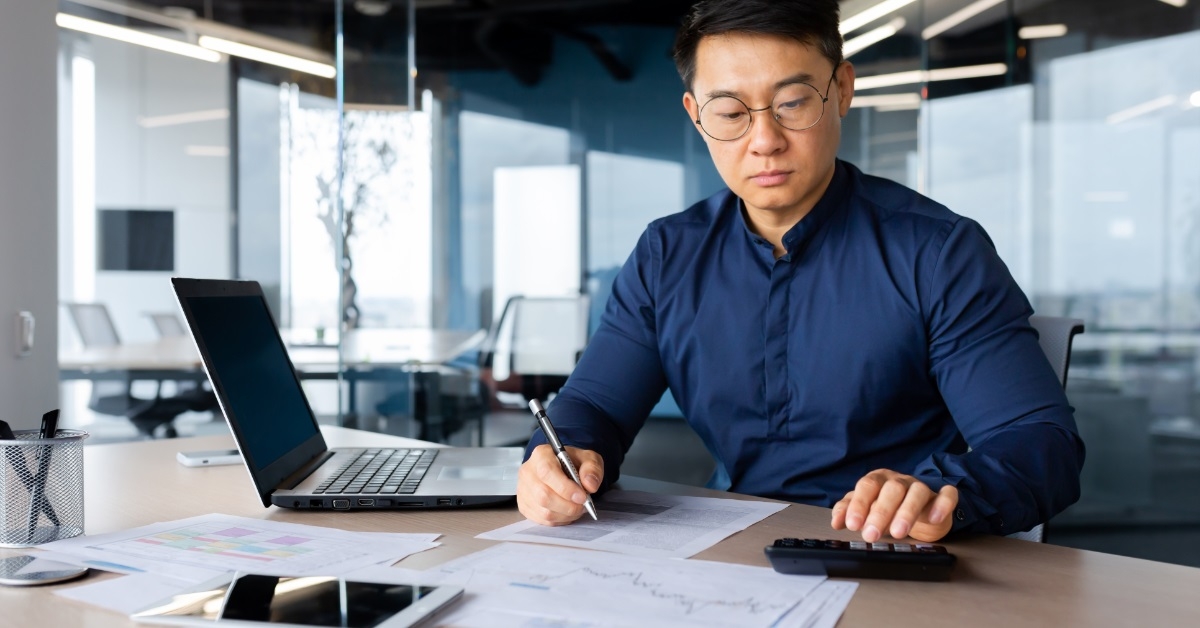 male asian accountant working at office
