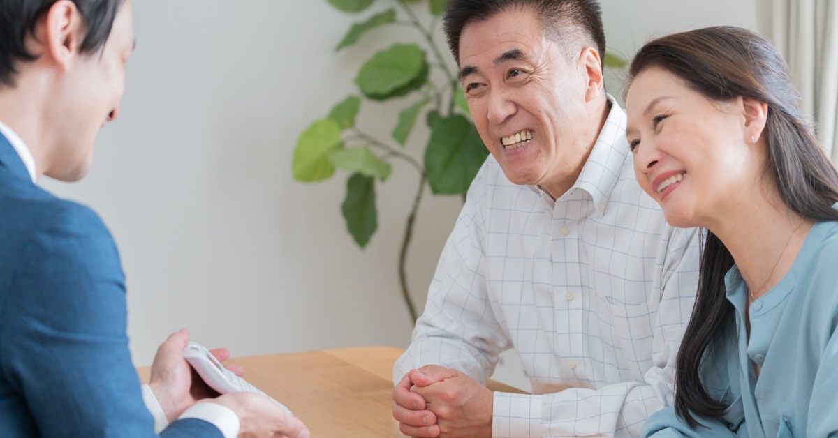 asian couple consulting male finance advisor