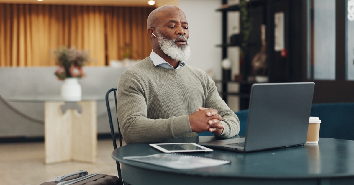 man on video call in office