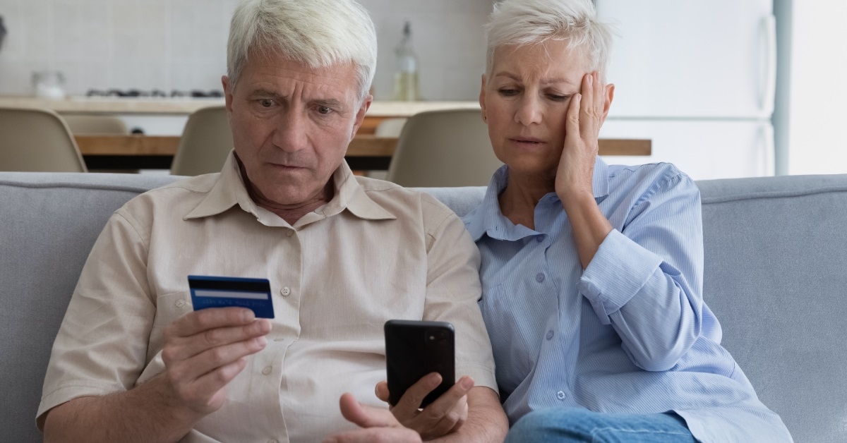 shocked couple getting scammed online