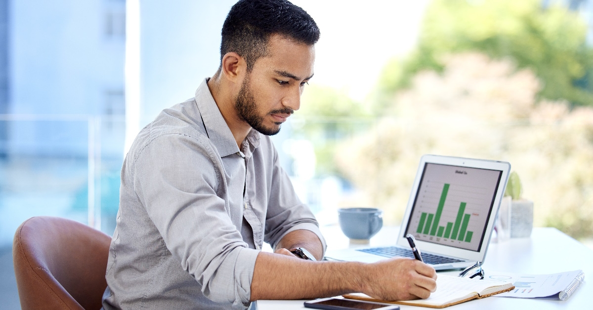 young man analyzing budget at work