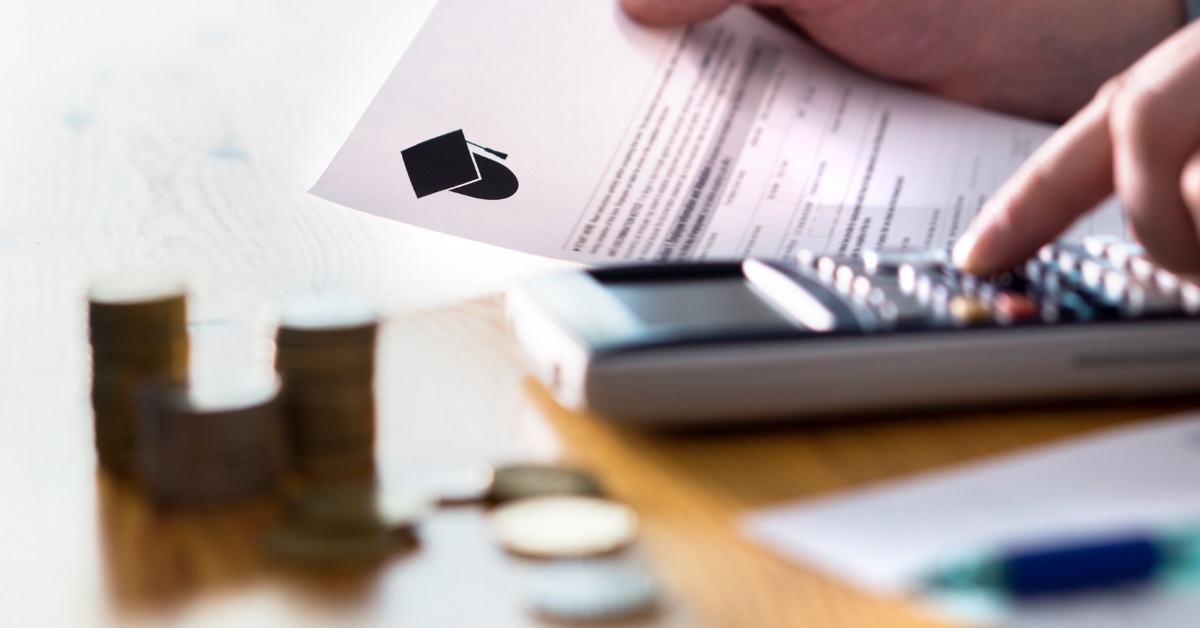 man calculating college funds using calculator