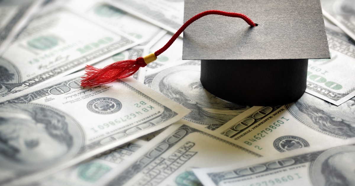 graduation hat on banknotes 