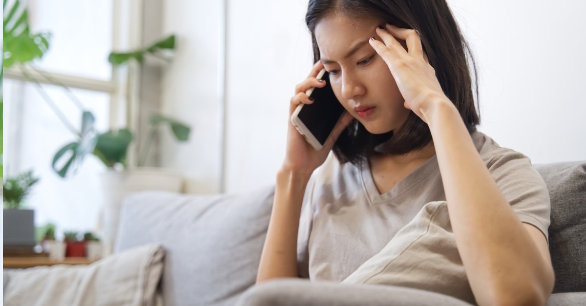 angry asian woman talking on phone