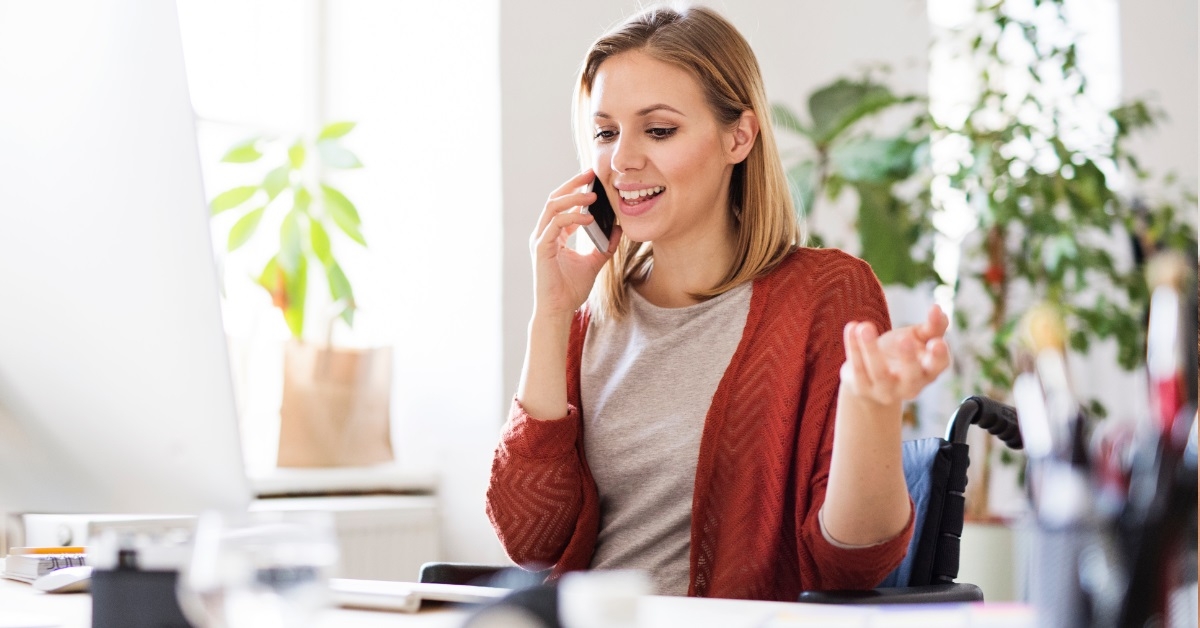 handicapped woman working at home office