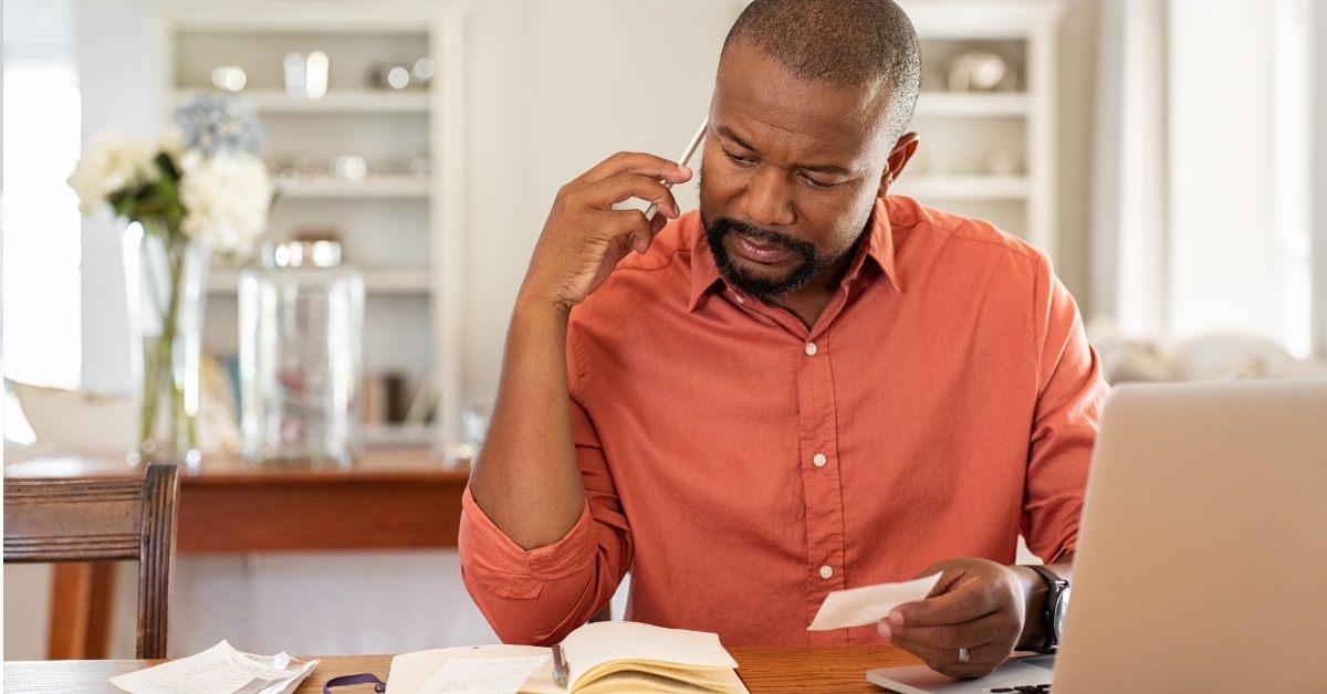 african american man reviewing bills