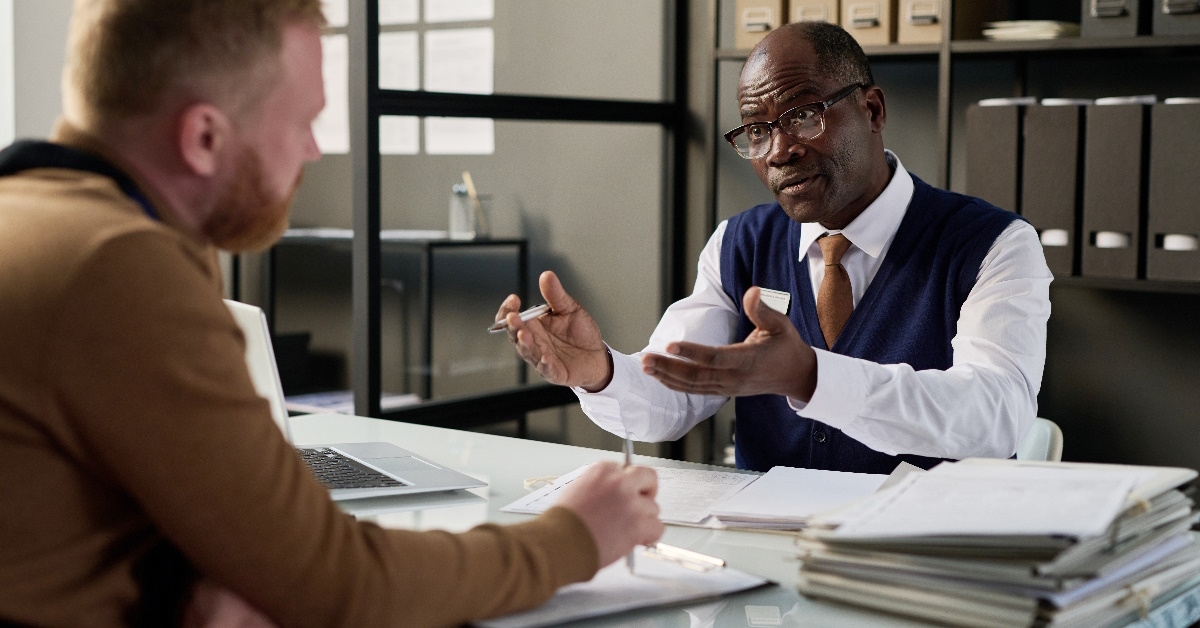 Black attorney is providing consultation to a client.