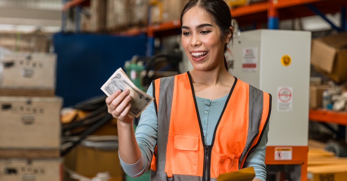 female engineer happy after receiving salary