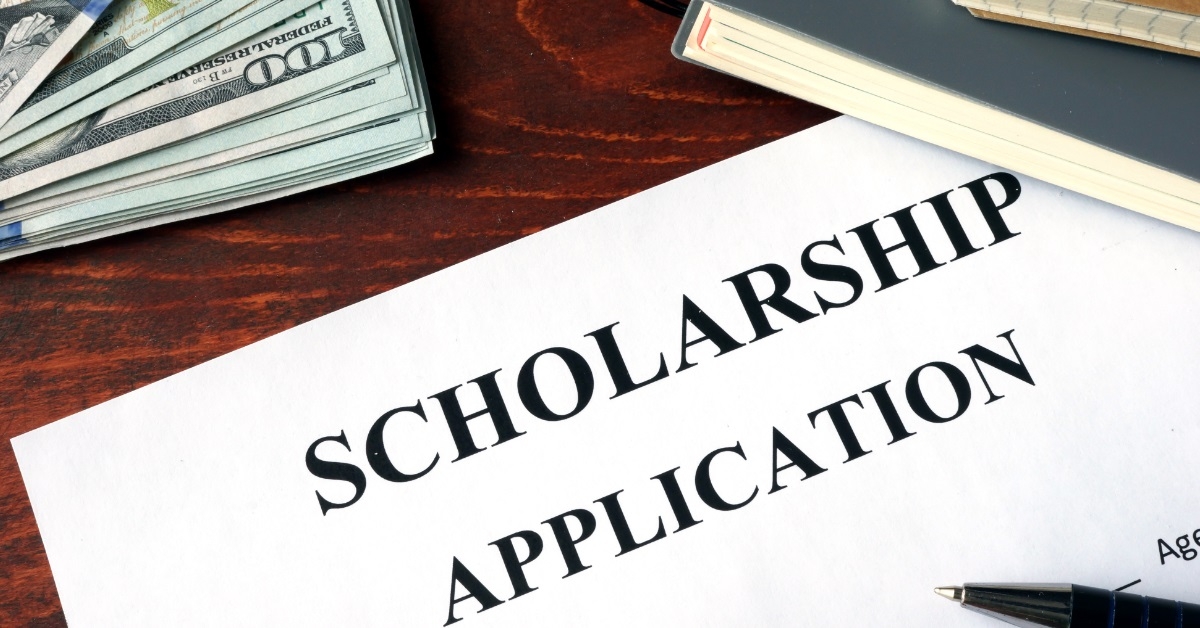 scholarship application with banknotes on table