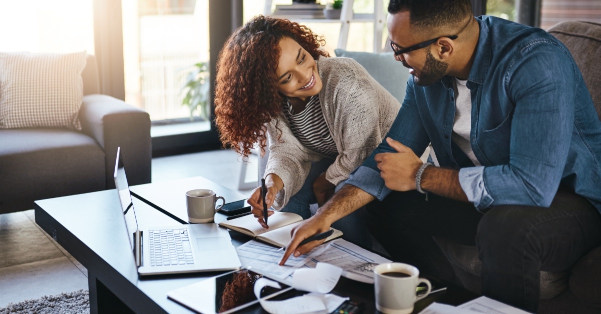 african american couple sorting bills