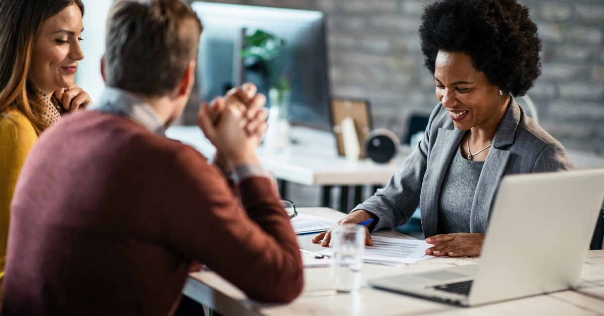 couple consulting African American financial advisor