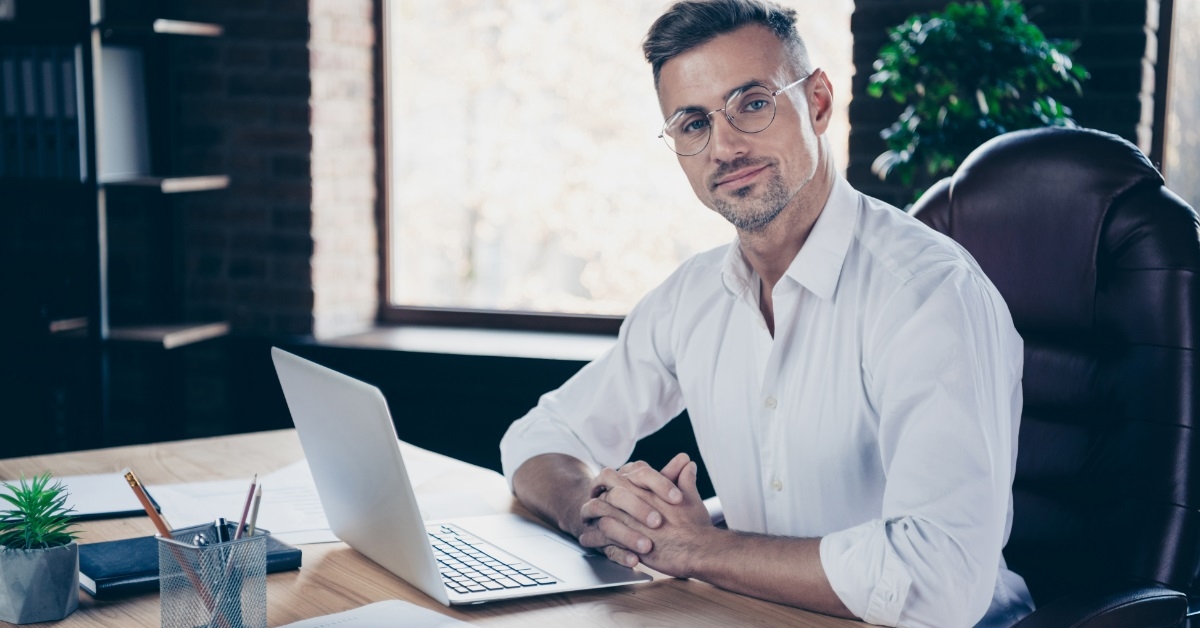 confident handsome businessman at office