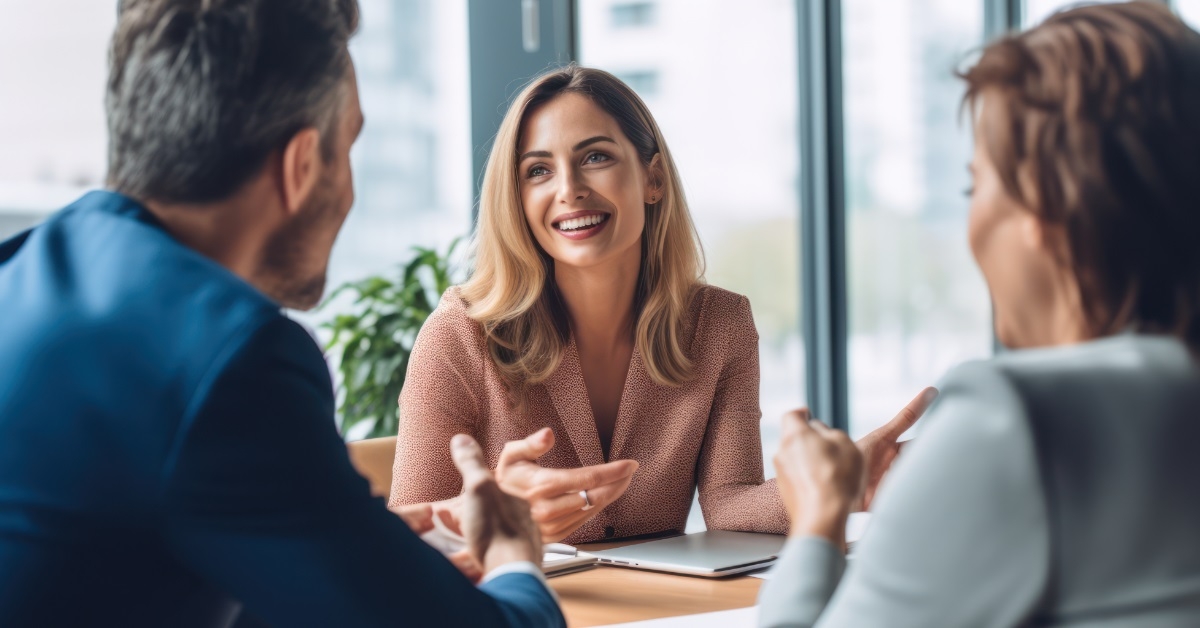 couple consulting female finance advisor