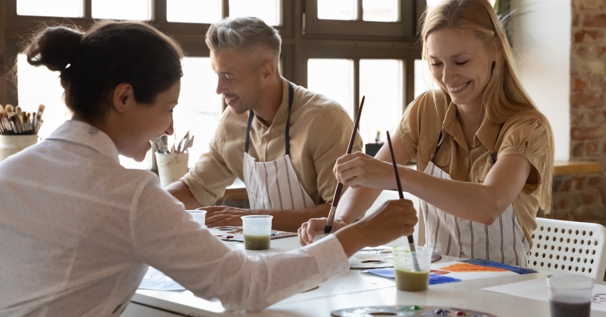 people enjoying at diverse art class
