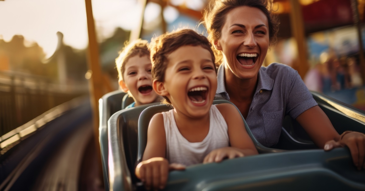 mother enjoying roller coaster with son 