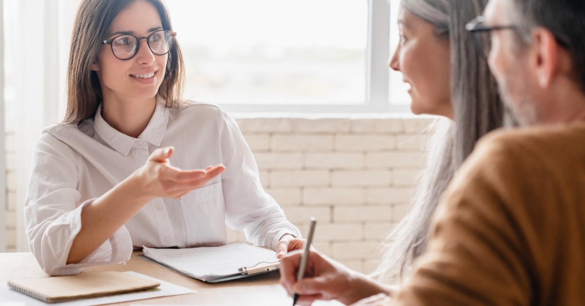 female lawyer talking to couple