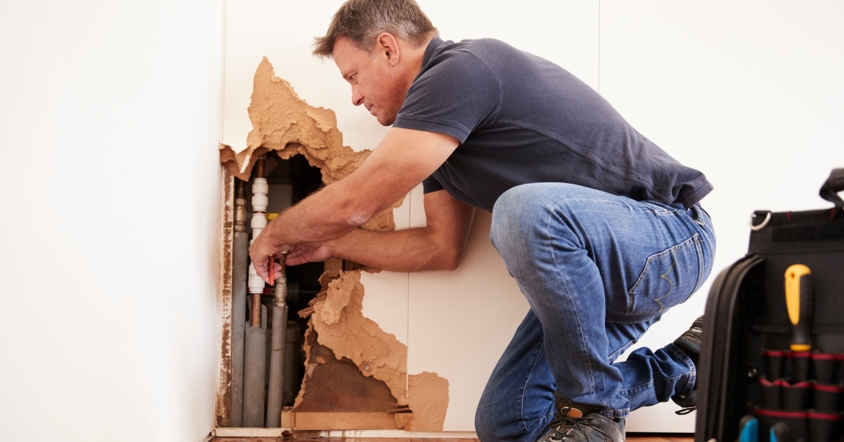 repairing burst water pipe