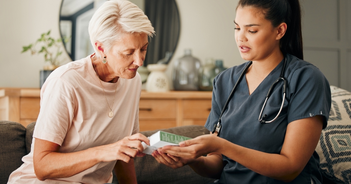 doctor helps an elderly patient