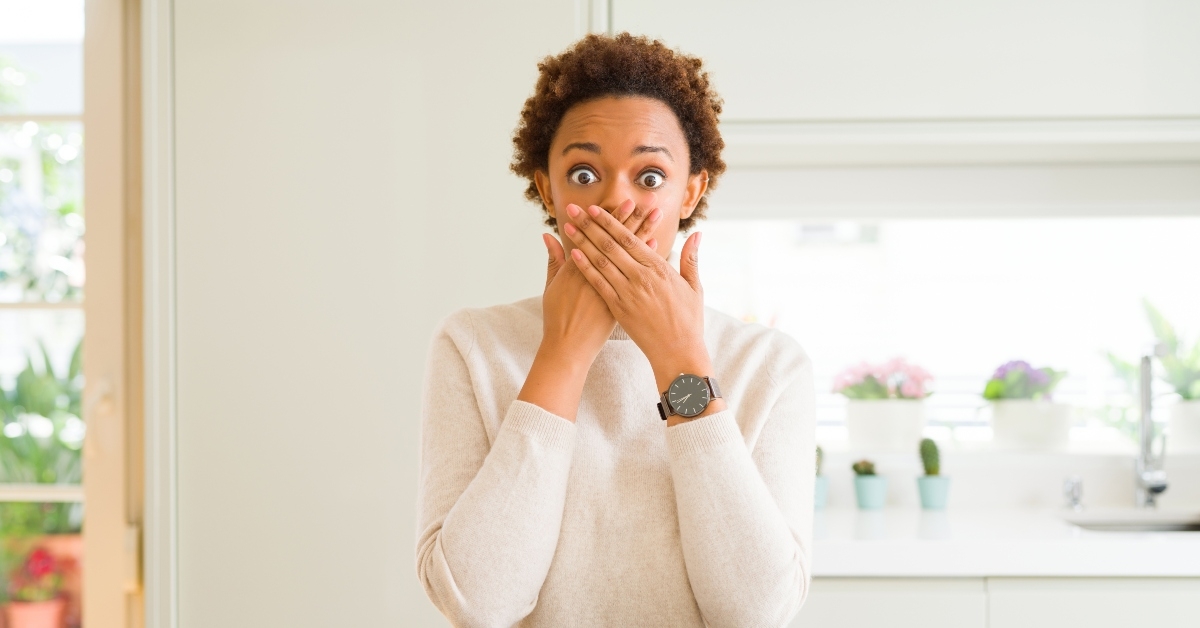 woman shocked covering mouth