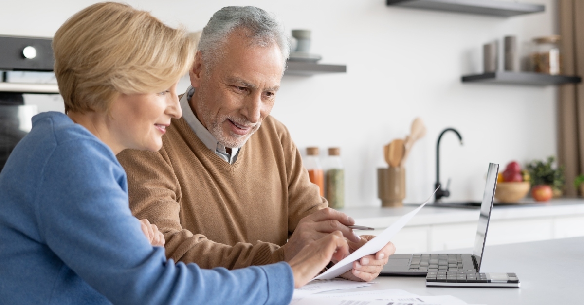 mature family couple check utility bills