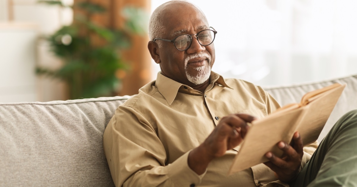 african american man reading book