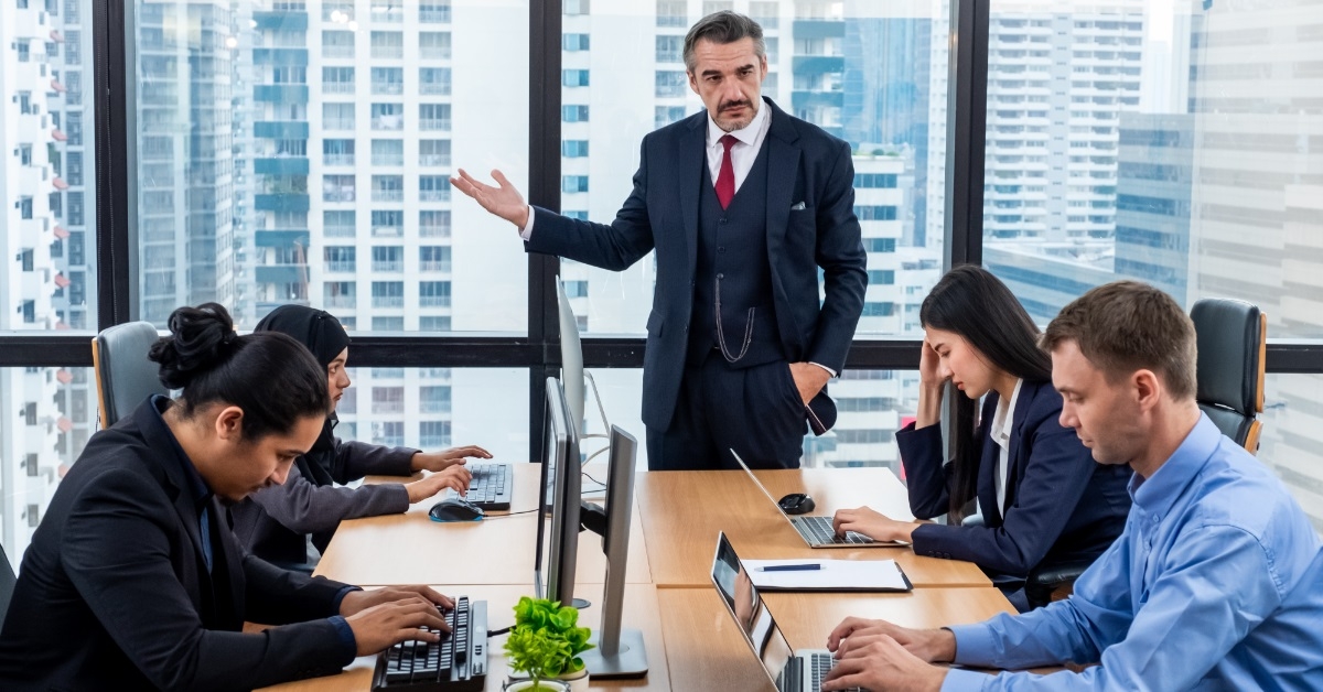 boss angry at employees in conference