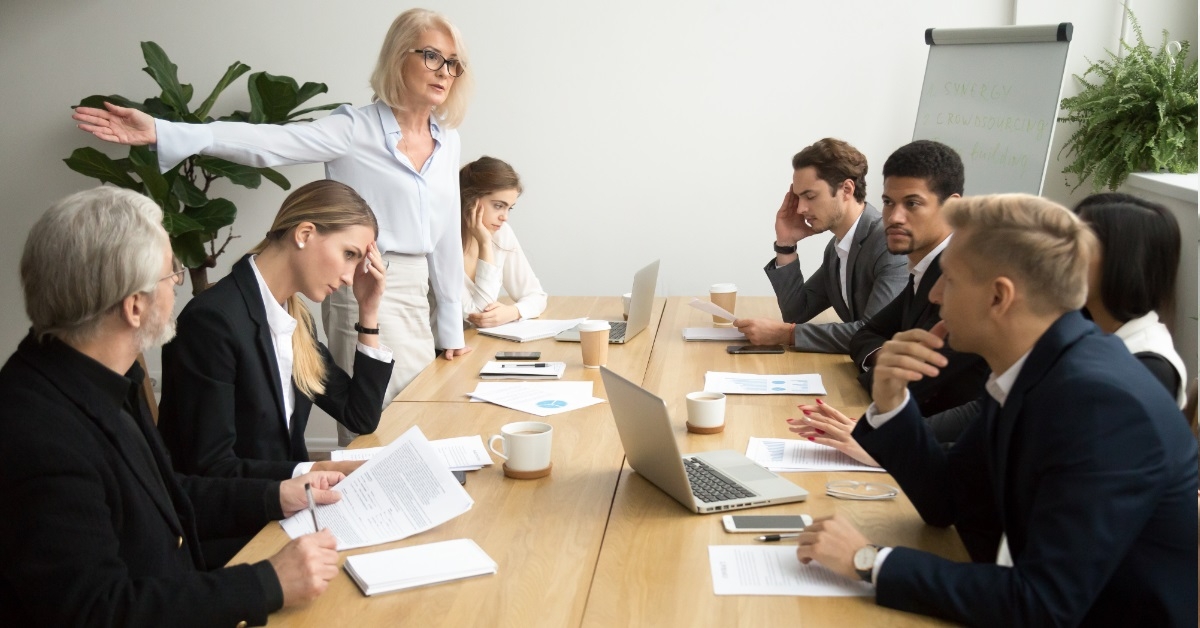 senior female boss firing employee