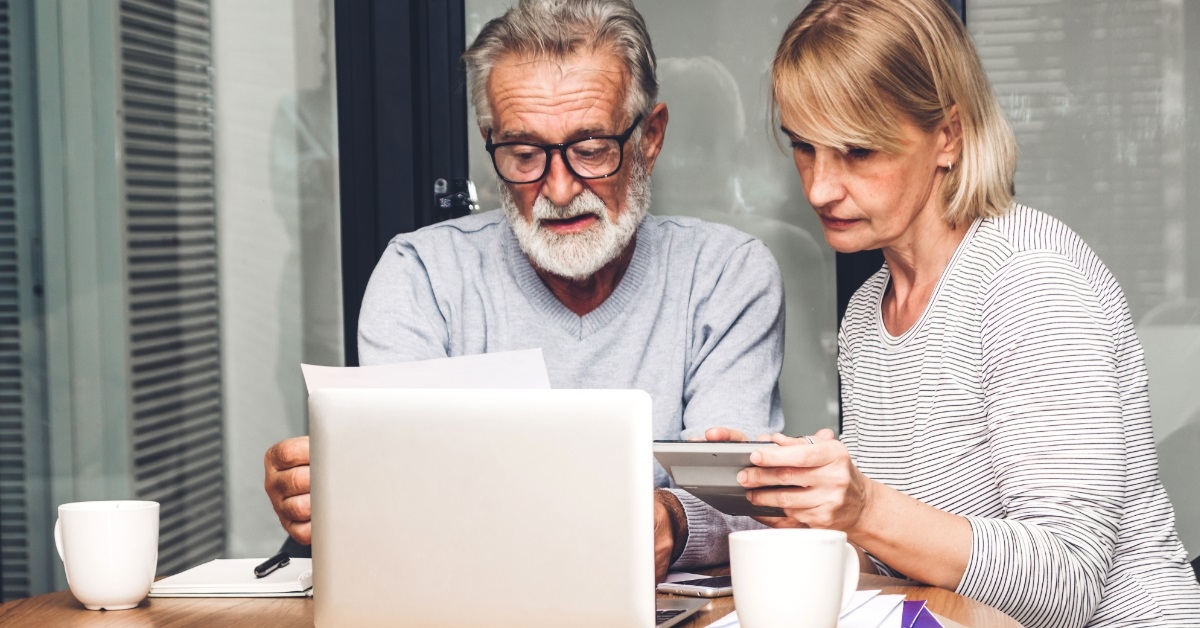 senior couple reviewing utility bills