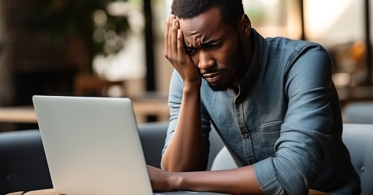 african american looking at laptop