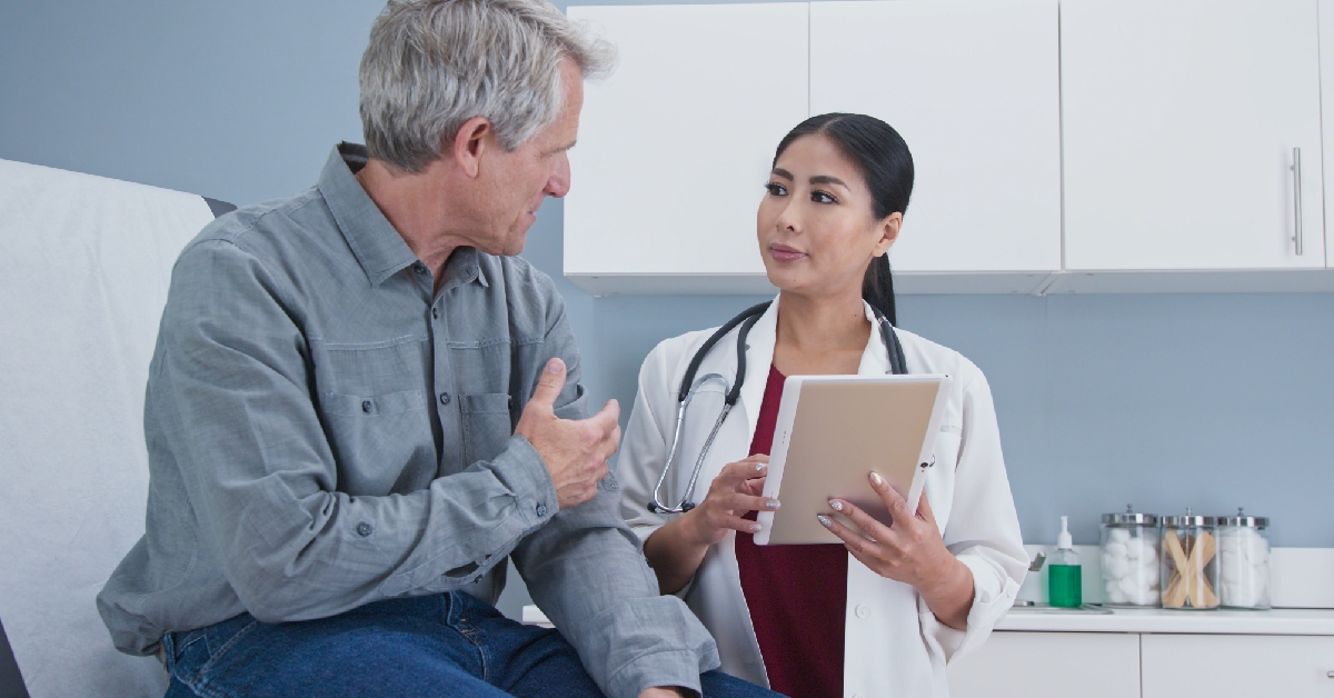 asian woman doctor talking to a patient