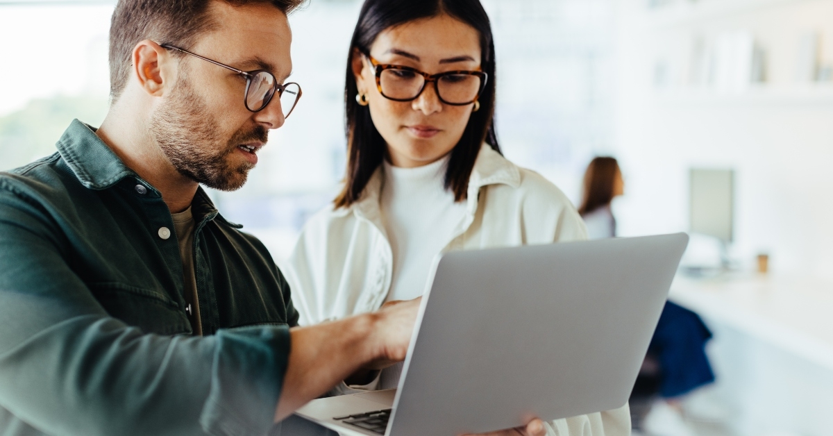 design professionals using a laptop together