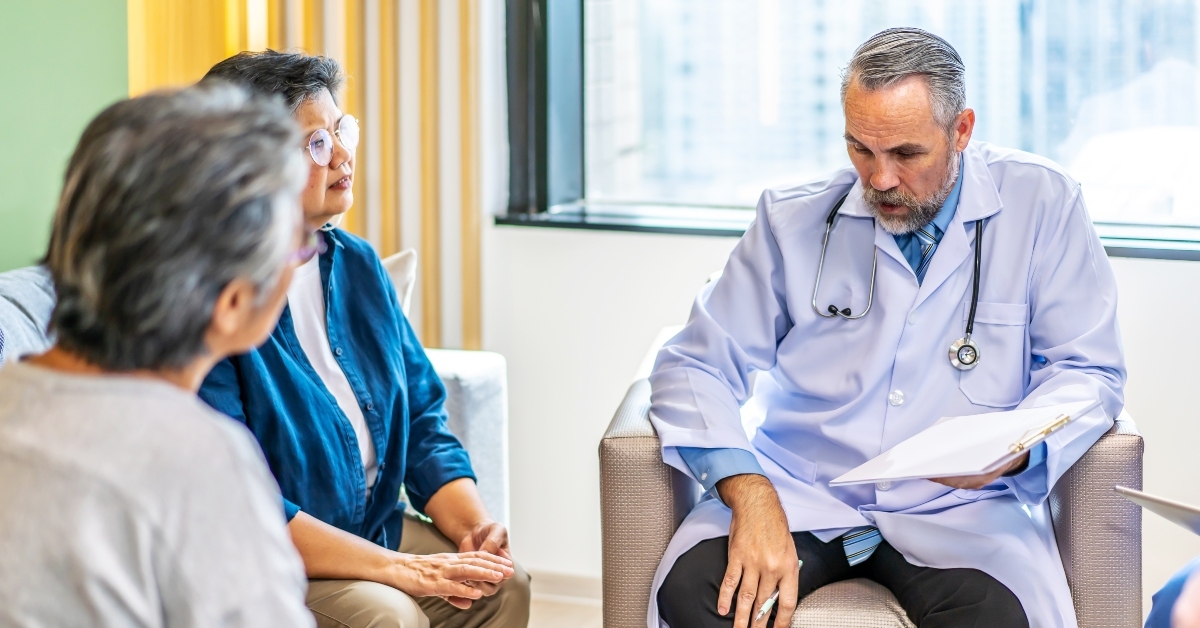 senior people listening to male doctor