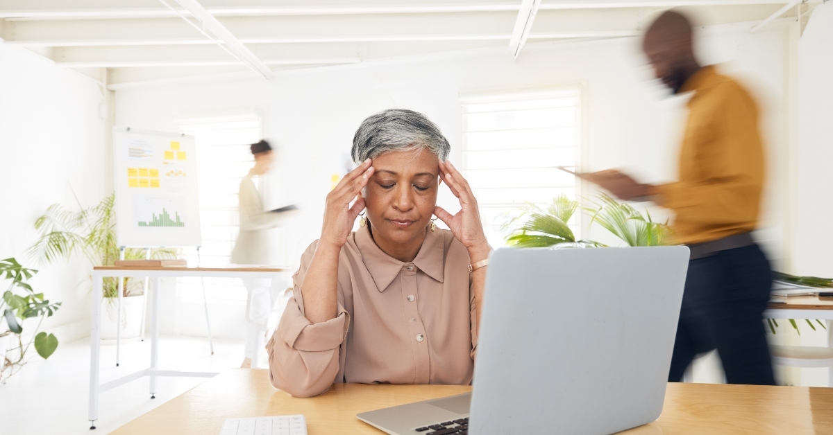 stressed senior woman with headache
