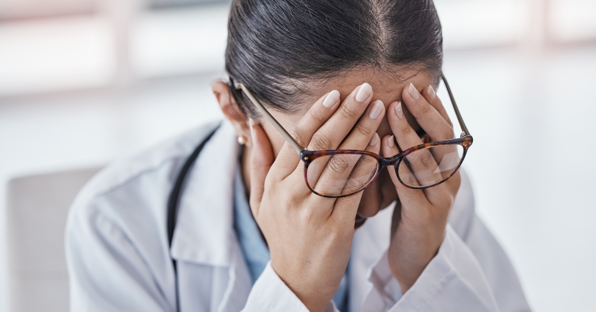 woman with headache in office