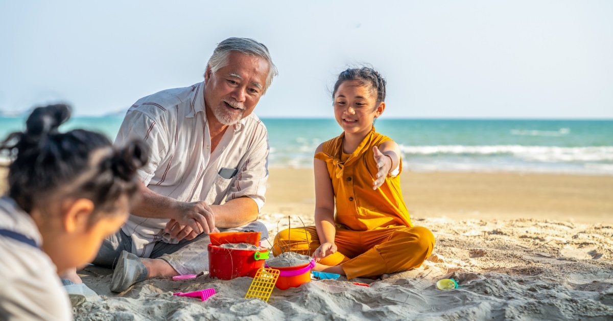asian family on beach vacation