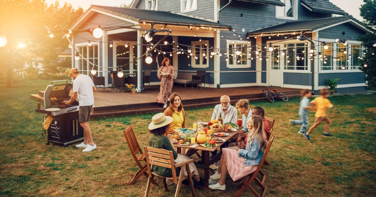 family enjoying outdoor bbq party