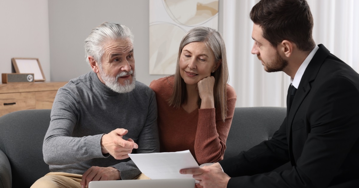 senior couple consulting insurance agent