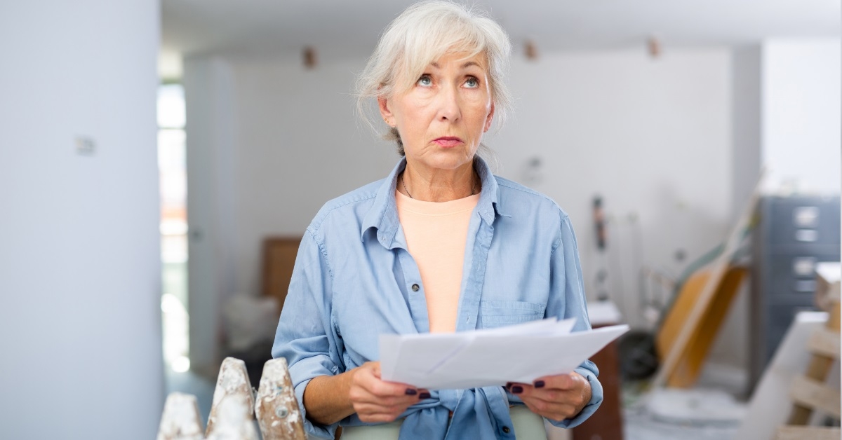 senior female designer inspecting room
