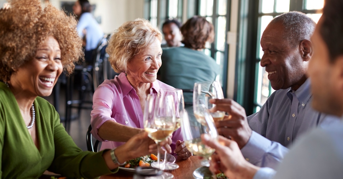 senior friends celebrating at restaurant