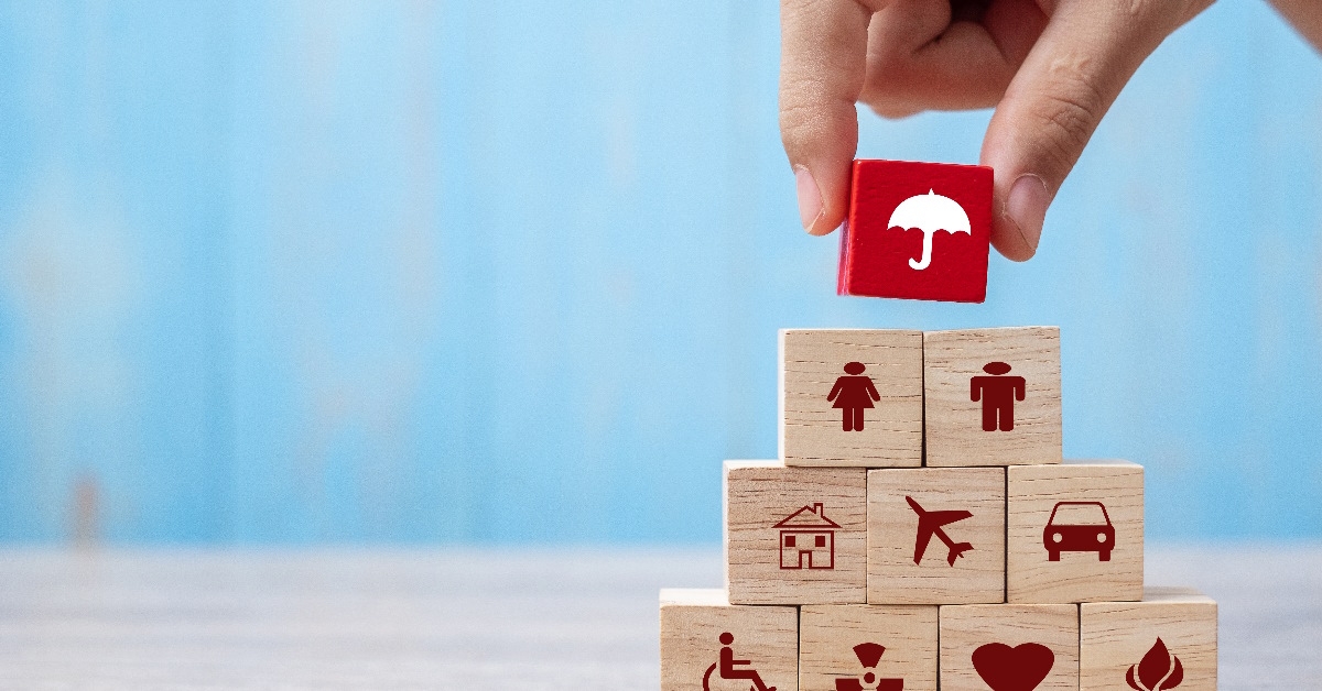 hand arranging healthcare blocks