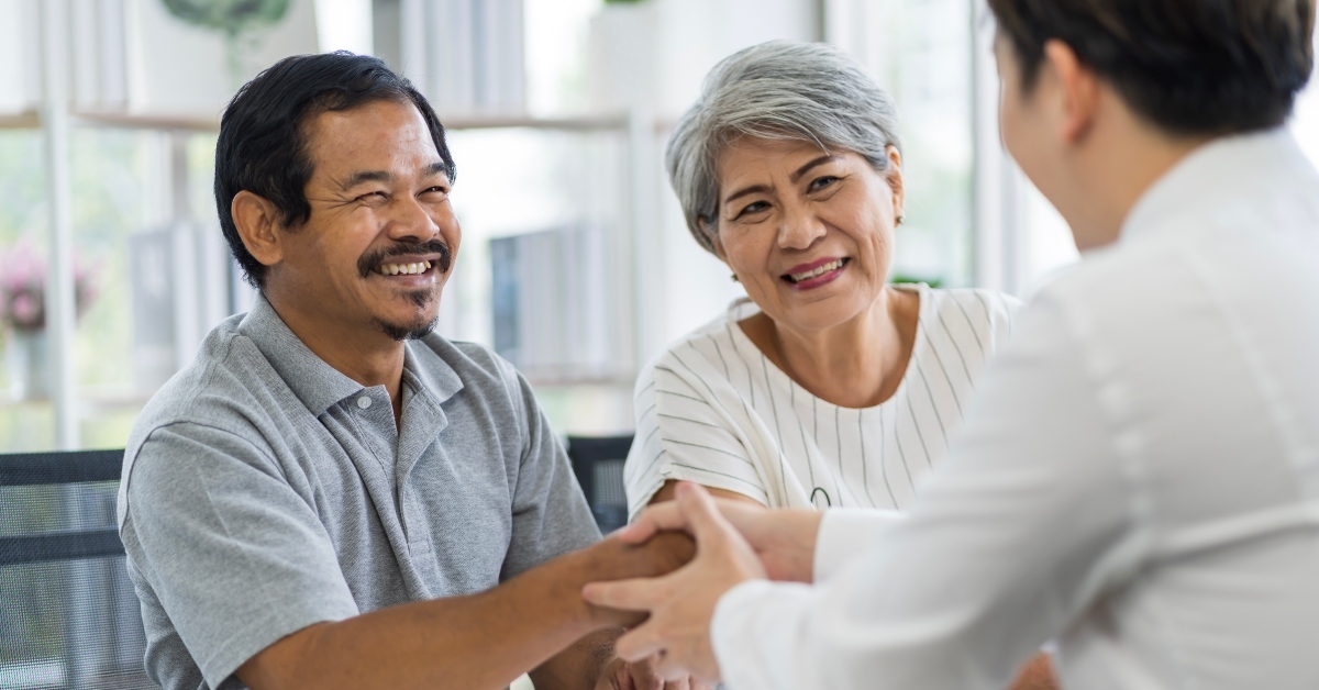 asian seniors talking to a financial planner