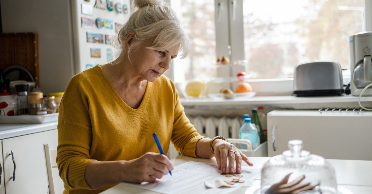 senior woman filling out statements
