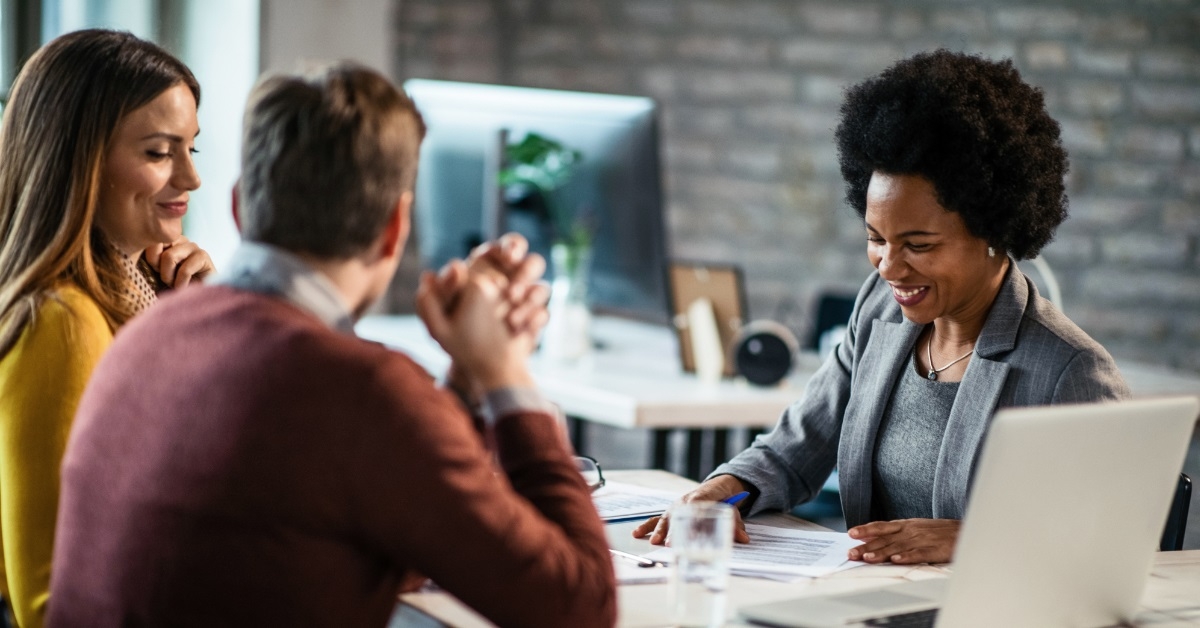 couple consulting female finance advisor