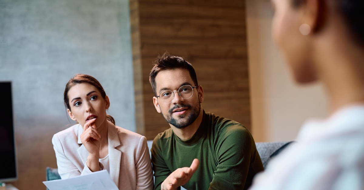 couple communicating with insurance agent